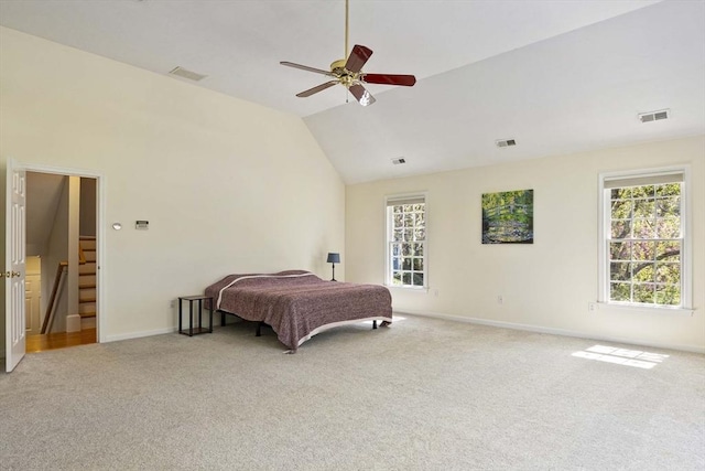 bedroom with baseboards, light colored carpet, and visible vents