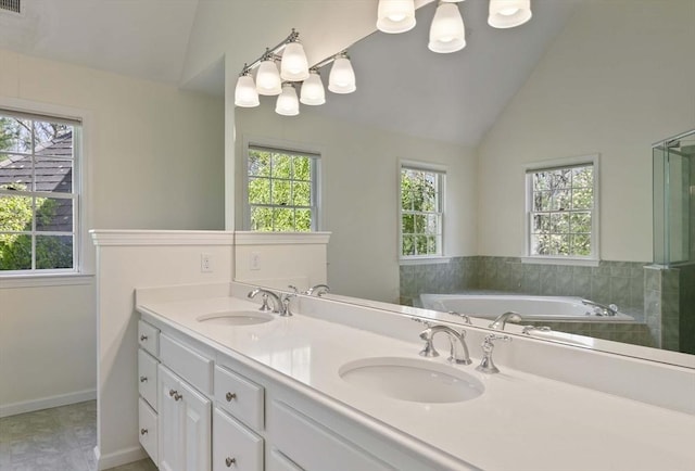 full bath featuring vaulted ceiling, a wealth of natural light, and a sink