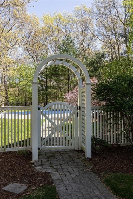 view of gate featuring fence