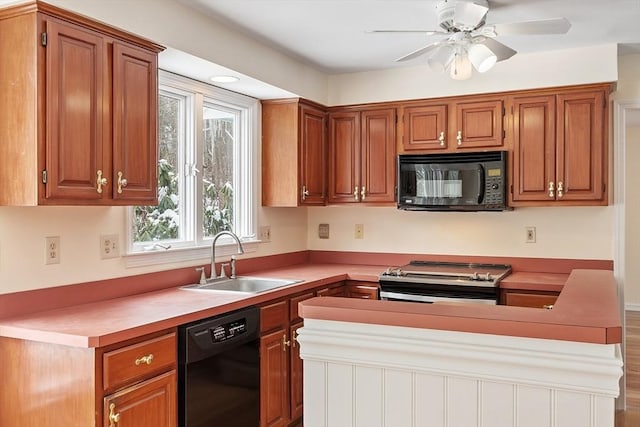 kitchen featuring sink, ceiling fan, and black appliances