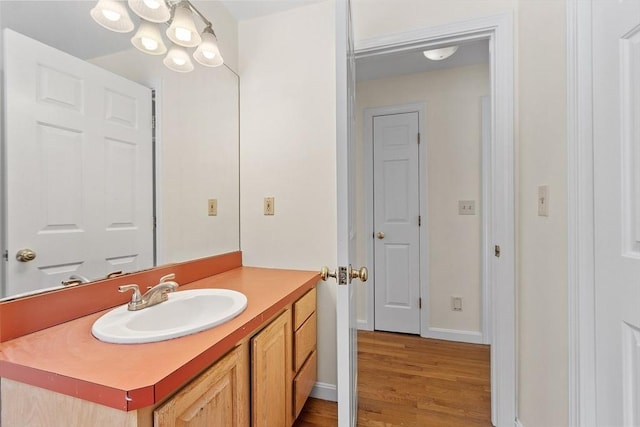 bathroom with vanity and hardwood / wood-style floors