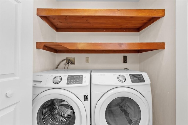 washroom with independent washer and dryer