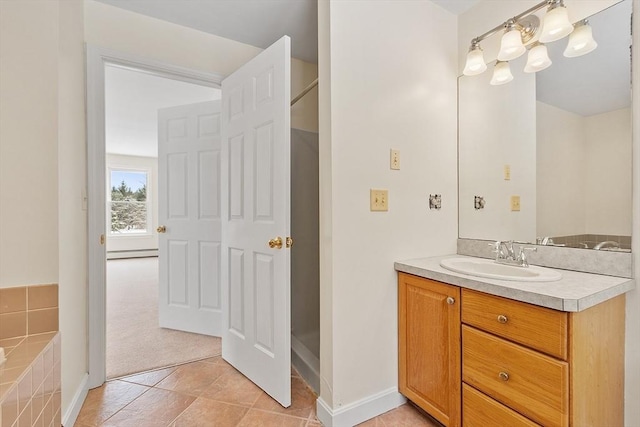 bathroom with baseboard heating, tile patterned floors, and vanity