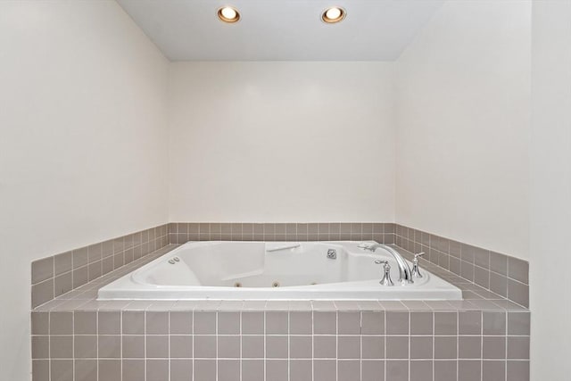 bathroom with tiled bath