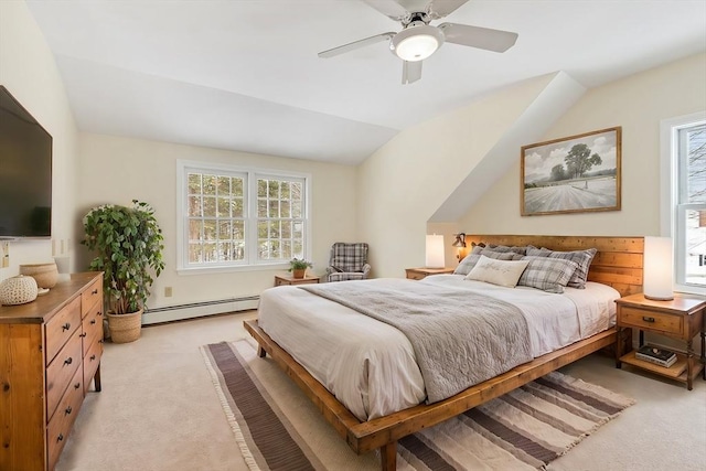 bedroom with light carpet, a baseboard heating unit, vaulted ceiling, and ceiling fan