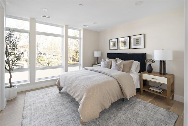 bedroom with light hardwood / wood-style floors