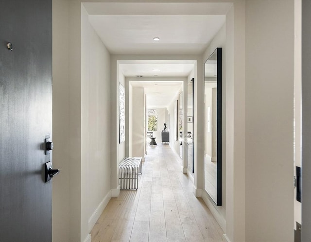 hallway featuring light wood-type flooring