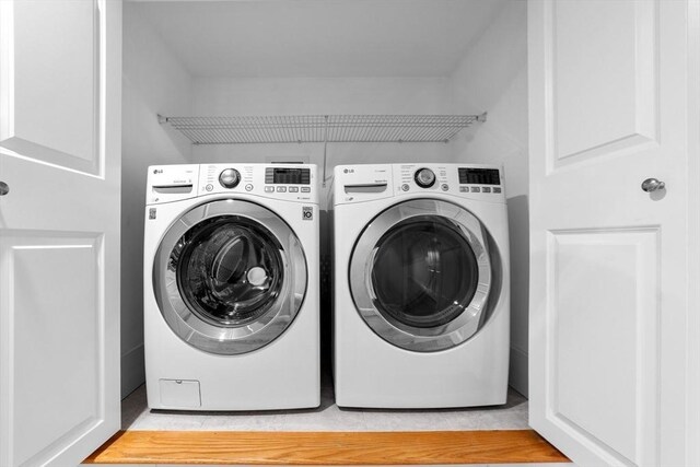 laundry area featuring laundry area and washer and clothes dryer