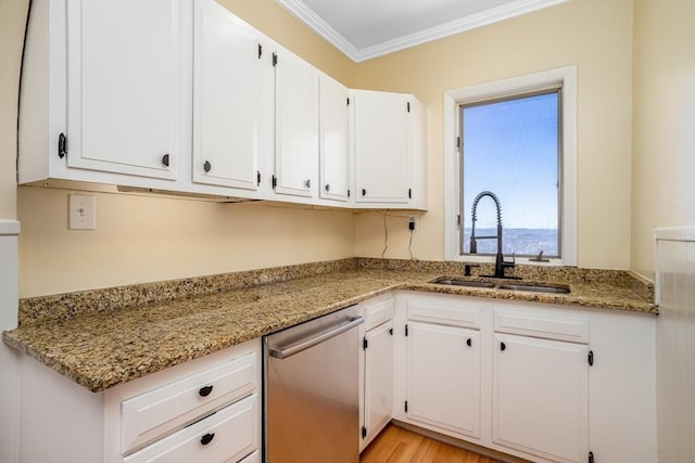 kitchen with crown molding, white cabinets, a sink, and stainless steel dishwasher