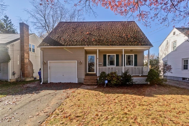 view of front of property with a porch and a garage