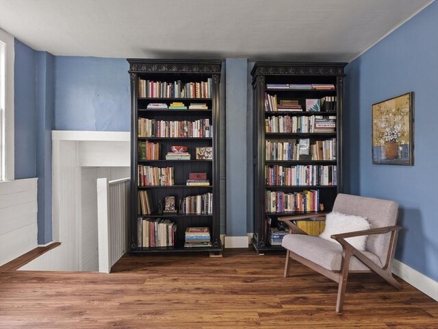 living area featuring wood finished floors and baseboards