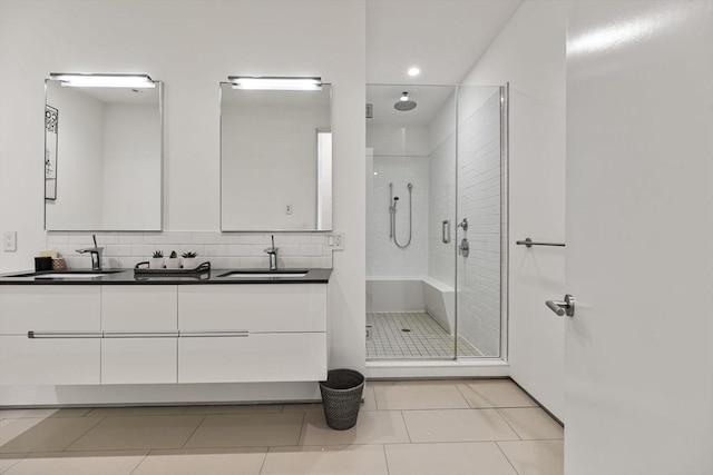 618 E 2nd St Unit 2, Boston, MA 02127 - full bath with a stall shower, double vanity, tile patterned flooring, recessed lighting, and tasteful backsplash