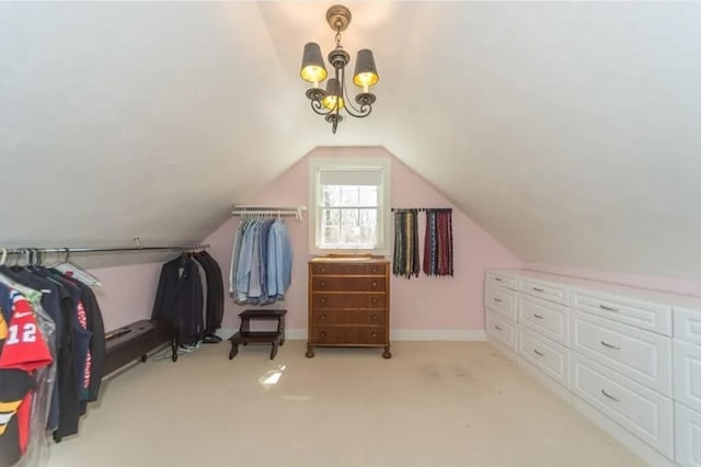 additional living space featuring an inviting chandelier, light colored carpet, and vaulted ceiling