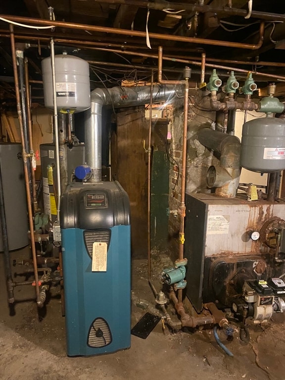 utility room featuring water heater