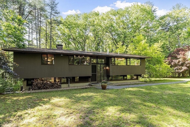 157 Carleton Rd, Carlisle, MA 01741 - view of front of property featuring a front yard and a chimney