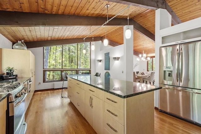 157 Carleton Rd, Carlisle, MA 01741 - kitchen with stainless steel appliances, radiator heating unit, a kitchen island, wood ceiling, and light wood-style flooring
