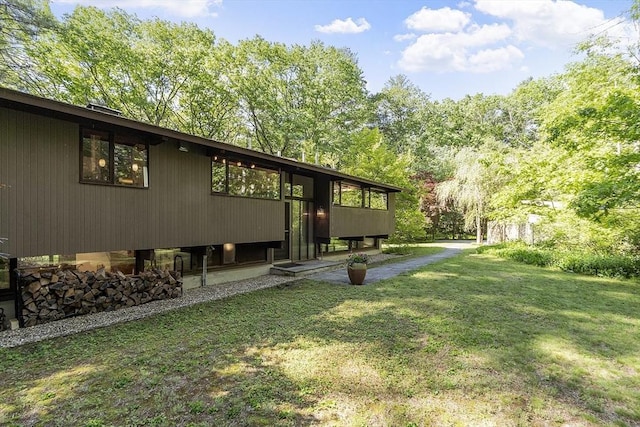 157 Carleton Rd, Carlisle, MA 01741 - view of home's exterior featuring a yard