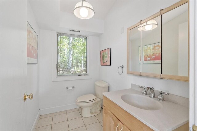 157 Carleton Rd, Carlisle, MA 01741 - bathroom with toilet, vanity, tile patterned floors, and baseboards