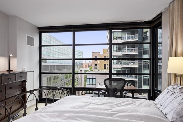 580 Washington St Unit 10A, Boston, MA 02111 - bedroom featuring floor to ceiling windows and carpet