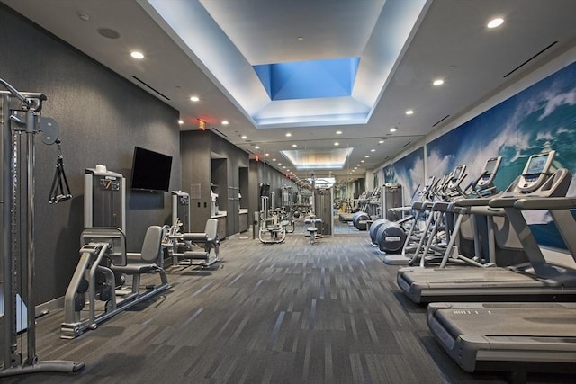 580 Washington St Unit 10A, Boston, MA 02111 - gym featuring a tray ceiling, carpet flooring, and recessed lighting