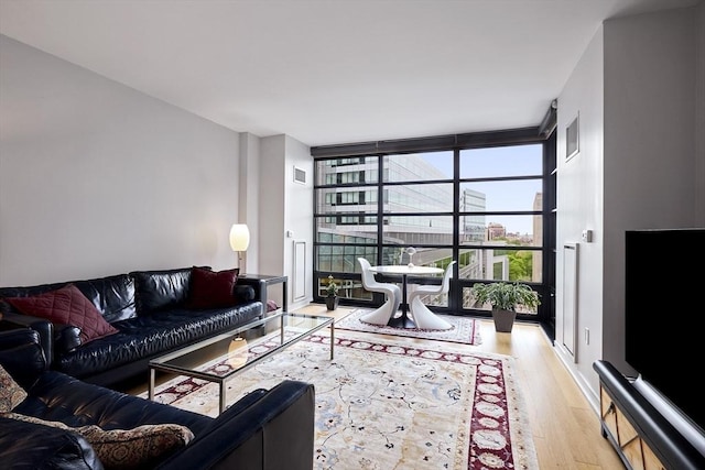 580 Washington St Unit 10A, Boston, MA 02111 - living area featuring expansive windows and light wood-style floors