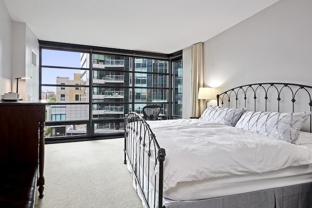 580 Washington St Unit 10A, Boston, MA 02111 - carpeted bedroom featuring a wall of windows