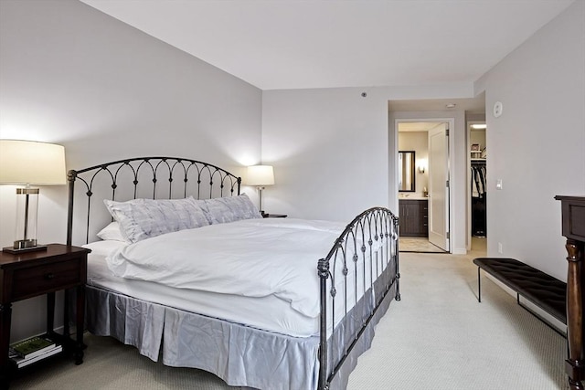 580 Washington St Unit 10A, Boston, MA 02111 - bedroom with light colored carpet, ensuite bath, and a spacious closet