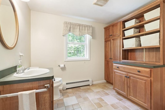232 Wallum Lake Rd, Douglas, MA 01516 - bathroom featuring baseboard heating, vanity, and stone finish flooring