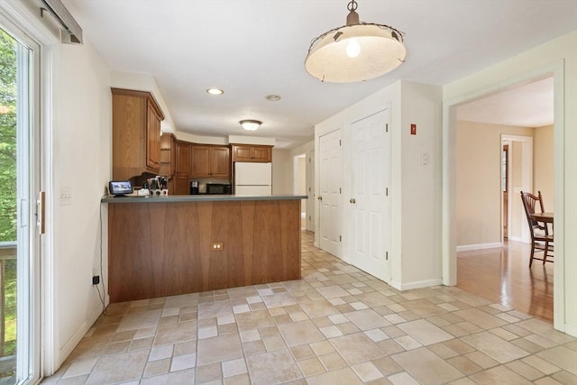 232 Wallum Lake Rd, Douglas, MA 01516 - kitchen featuring freestanding refrigerator, brown cabinets, a peninsula, black microwave, and recessed lighting