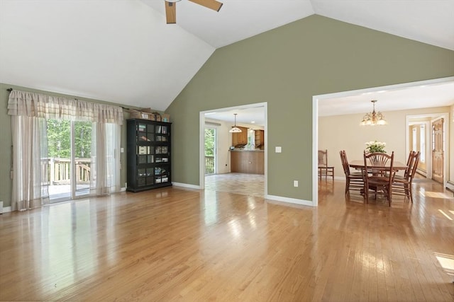 232 Wallum Lake Rd, Douglas, MA 01516 - living area featuring high vaulted ceiling, ceiling fan, a chandelier, and light wood-style flooring