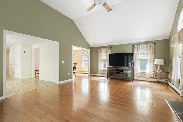 232 Wallum Lake Rd, Douglas, MA 01516 - unfurnished living room with a baseboard heating unit, a ceiling fan, healthy amount of natural light, light wood-style floors, and high vaulted ceiling