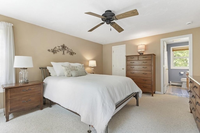 232 Wallum Lake Rd, Douglas, MA 01516 - bedroom with baseboard heating, light carpet, ensuite bathroom, and ceiling fan