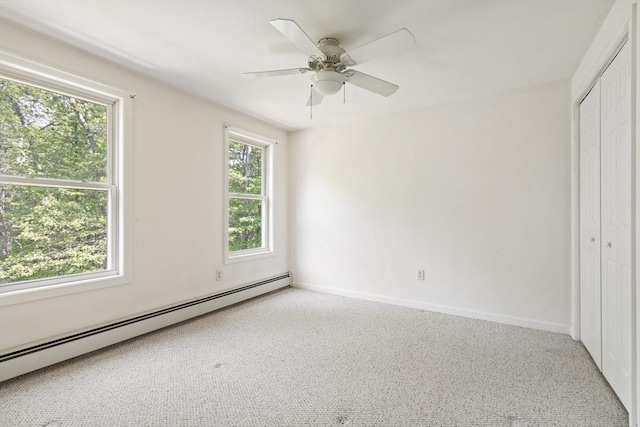 232 Wallum Lake Rd, Douglas, MA 01516 - unfurnished bedroom featuring a baseboard heating unit, a closet, carpet floors, and ceiling fan