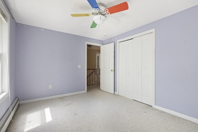 232 Wallum Lake Rd, Douglas, MA 01516 - unfurnished bedroom featuring baseboard heating, carpet floors, a closet, and ceiling fan