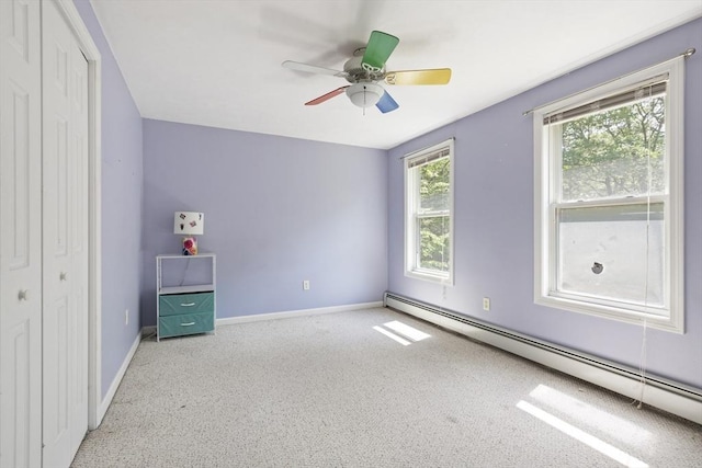 232 Wallum Lake Rd, Douglas, MA 01516 - unfurnished bedroom with a baseboard heating unit, carpet, a closet, and ceiling fan