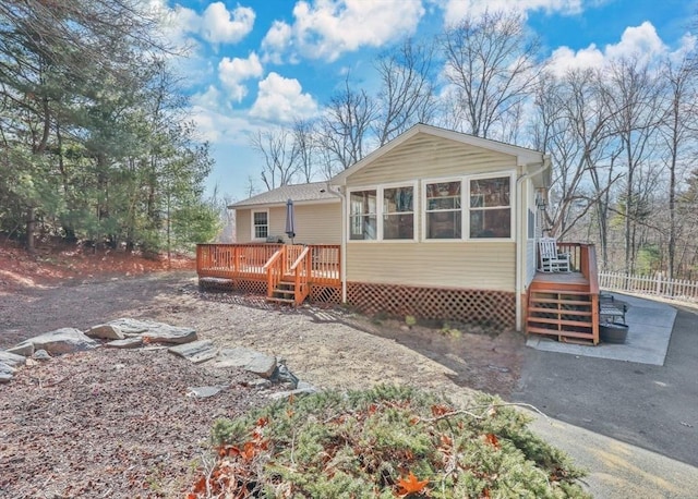 rear view of house with a deck