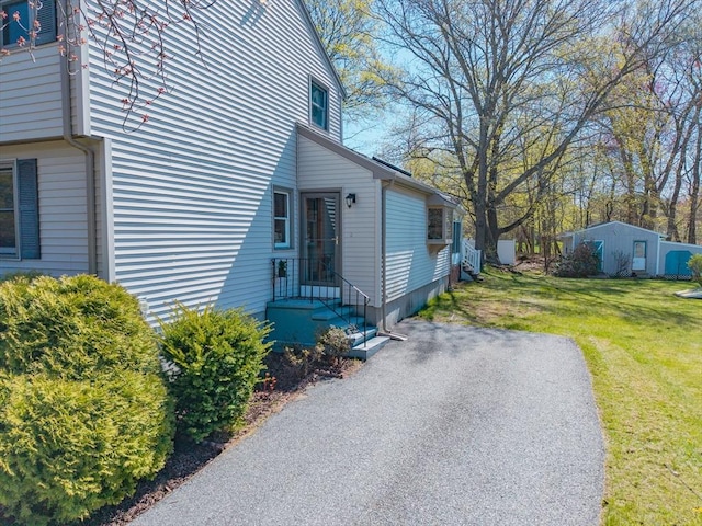 view of property exterior featuring a yard