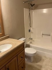 full bathroom with vanity, toilet, and bathing tub / shower combination