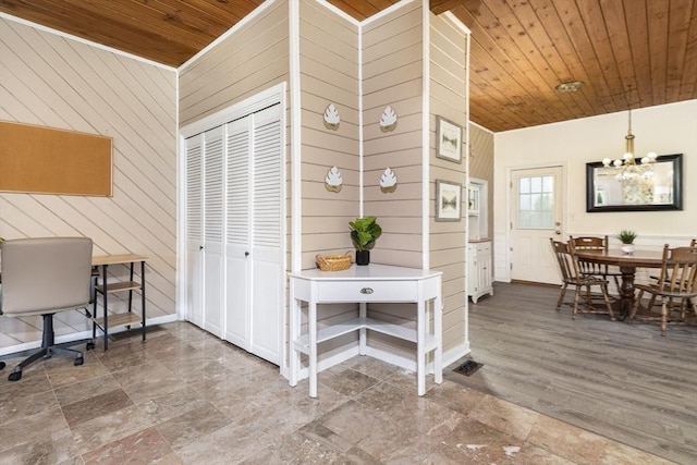 65 Water St Unit 2, Danvers, MA 01923 - office area featuring a chandelier, wooden walls, wood ceiling, and stone finish flooring