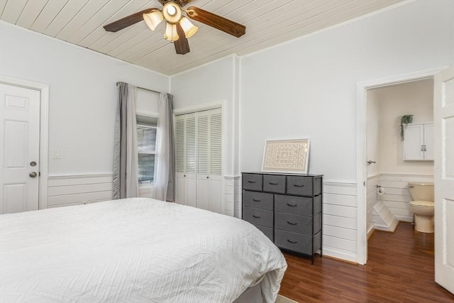 65 Water St Unit 2, Danvers, MA 01923 - bedroom featuring crown molding, wood ceiling, wainscoting, dark wood finished floors, and a closet