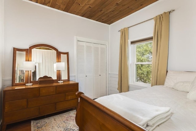 65 Water St Unit 2, Danvers, MA 01923 - bedroom with crown molding, a closet, and wood ceiling