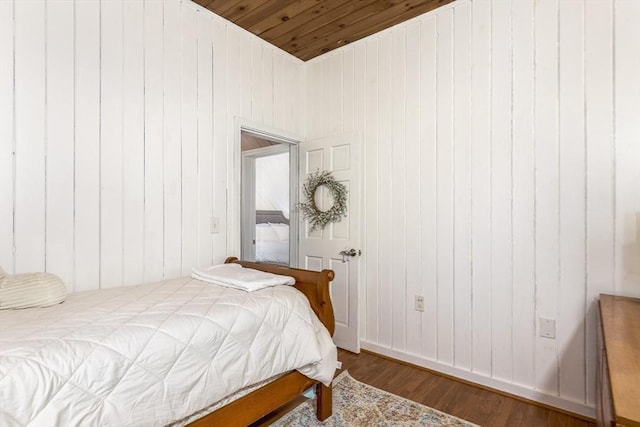 65 Water St Unit 2, Danvers, MA 01923 - bedroom with wood ceiling, wood finished floors, and wooden walls