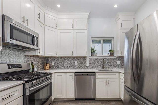 65 Water St Unit 2, Danvers, MA 01923 - kitchen featuring stainless steel appliances, light countertops, white cabinets, and recessed lighting