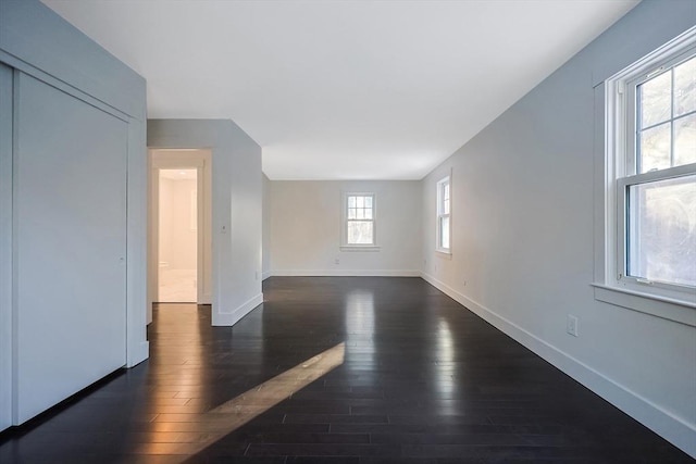 empty room featuring dark wood-type flooring