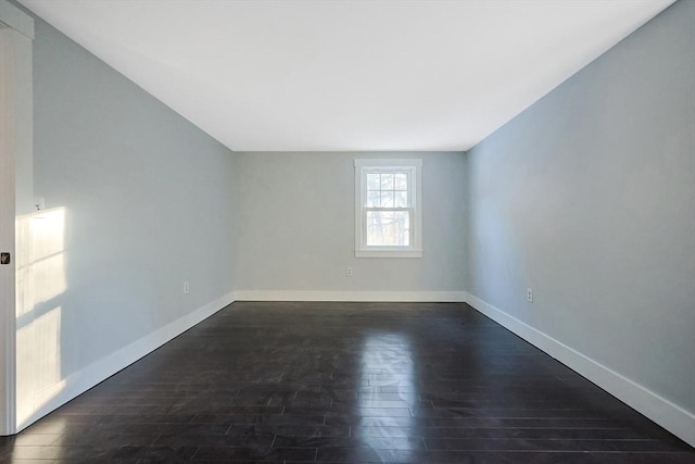 unfurnished room featuring dark hardwood / wood-style floors