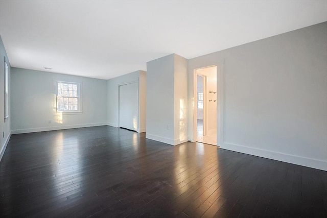 empty room featuring dark hardwood / wood-style floors