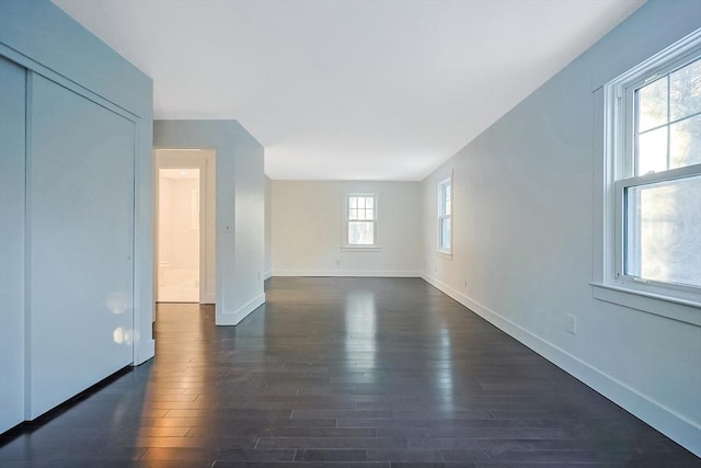 spare room featuring dark hardwood / wood-style flooring