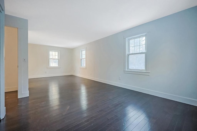 unfurnished room featuring dark hardwood / wood-style flooring