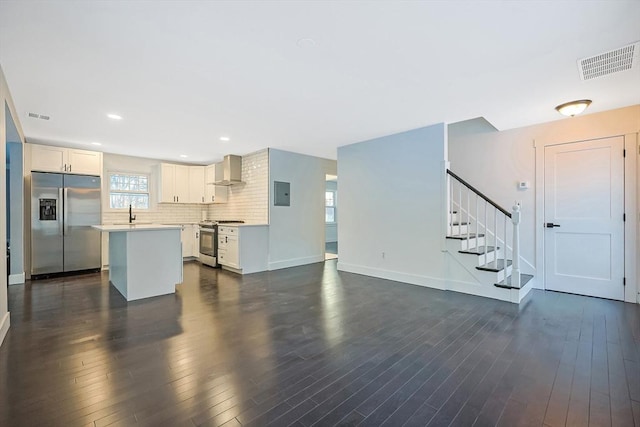 living room with dark hardwood / wood-style floors and electric panel