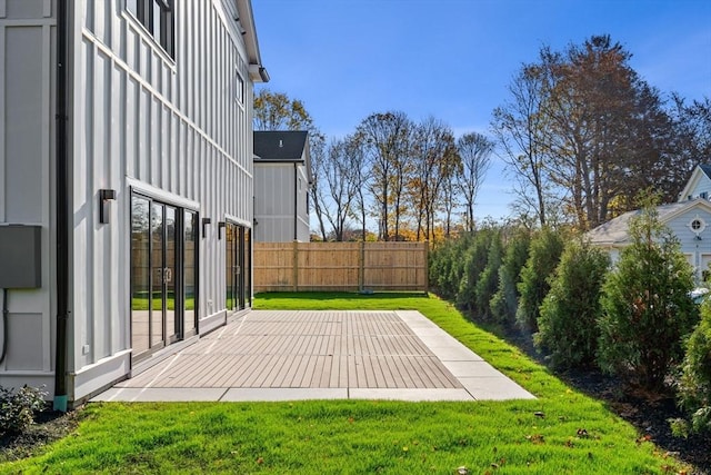 view of yard with a patio and fence